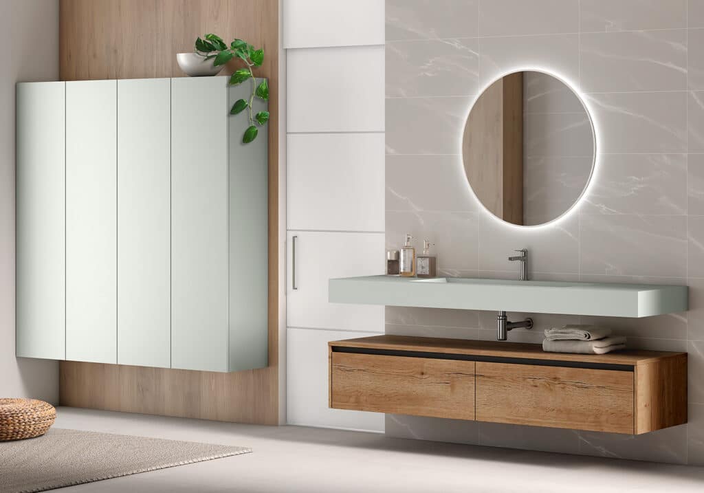 Mueble baño Iguazú Garbianti con lavabo sobre encimera y espejo redondo