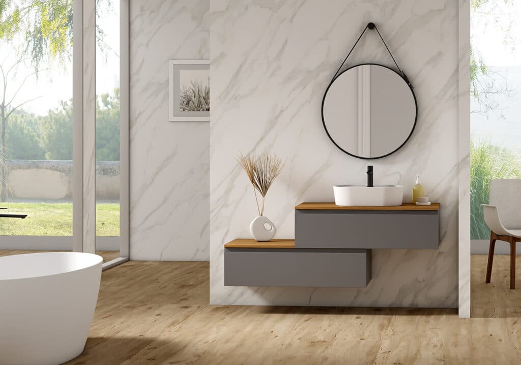 Mueble baño Vento Garbianti con lavabo sobre encimera y espejo redondo